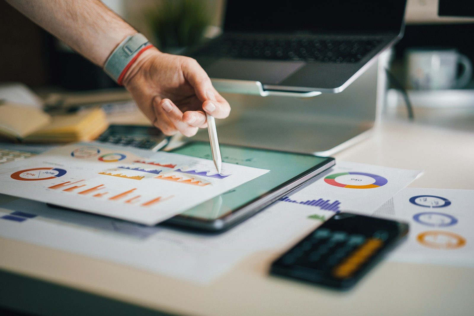 A person reviewing charts and paperwork.