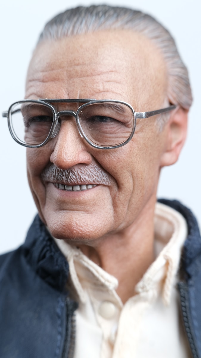 Portrait of an older adult wearing glasses.