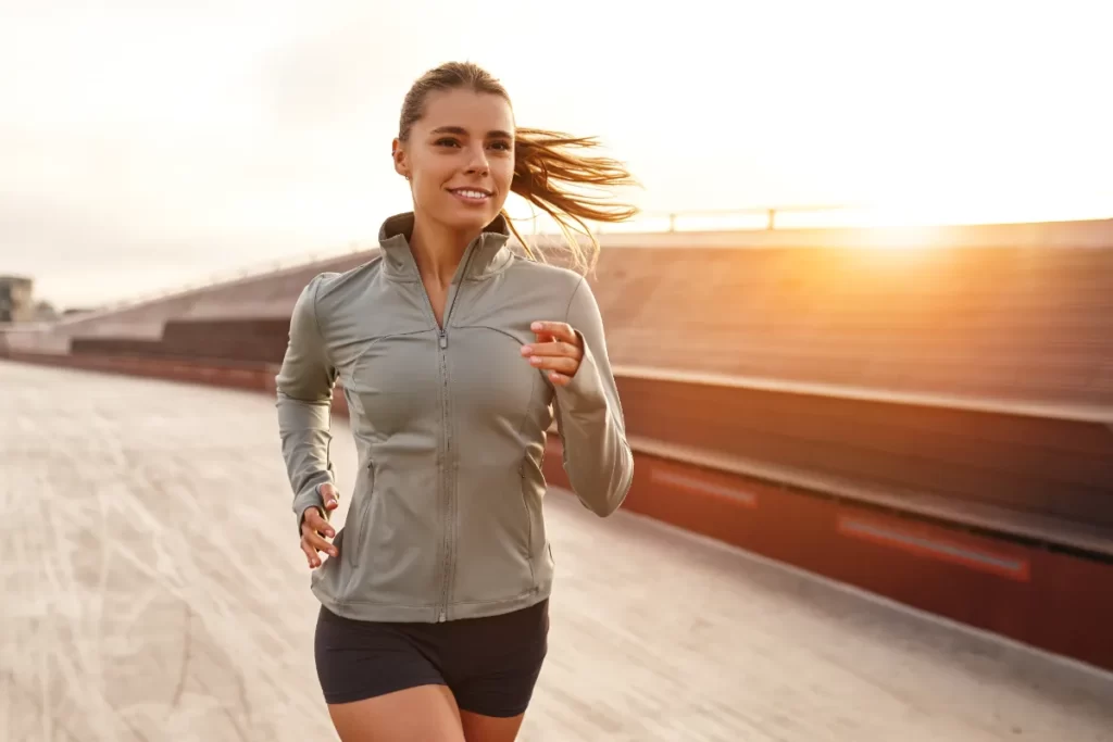 an-athletic-woman-running-gracefully-at-sunset-on-2026-03-24-21-58-24-utc