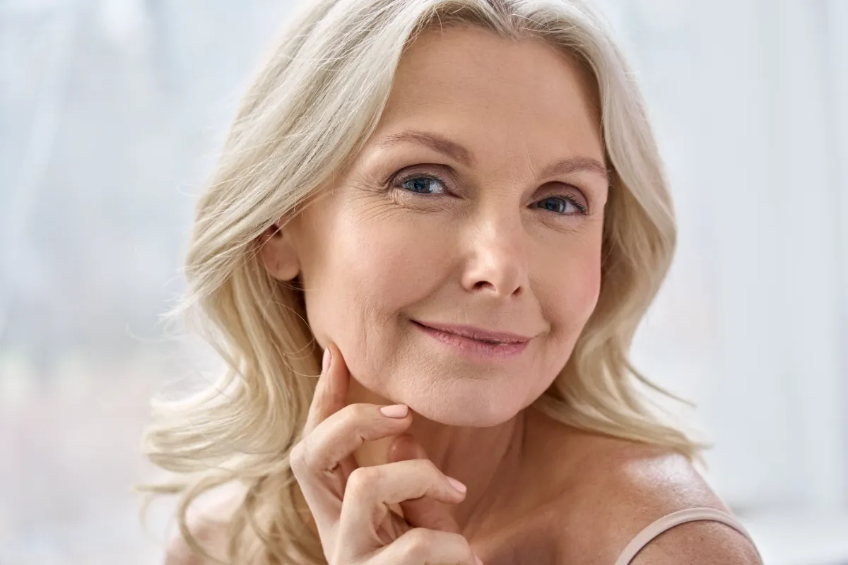 close up portrait of a smiling blond woman utc