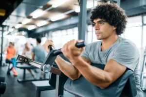 determined male working out in modern gym utc