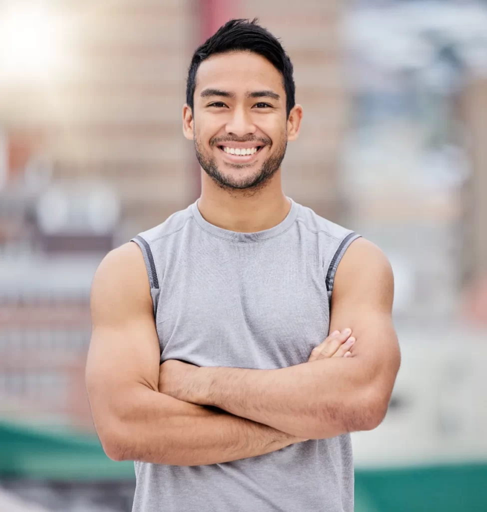happy personal trainer portrait of strong man and utc