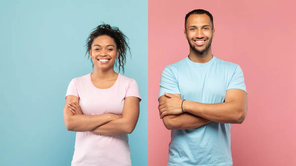 smiling man and woman posing with crossed arms utc