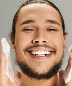 smiling-man-washing-his-face-with-soap-2026-01-09-10-44-24-utc (1)