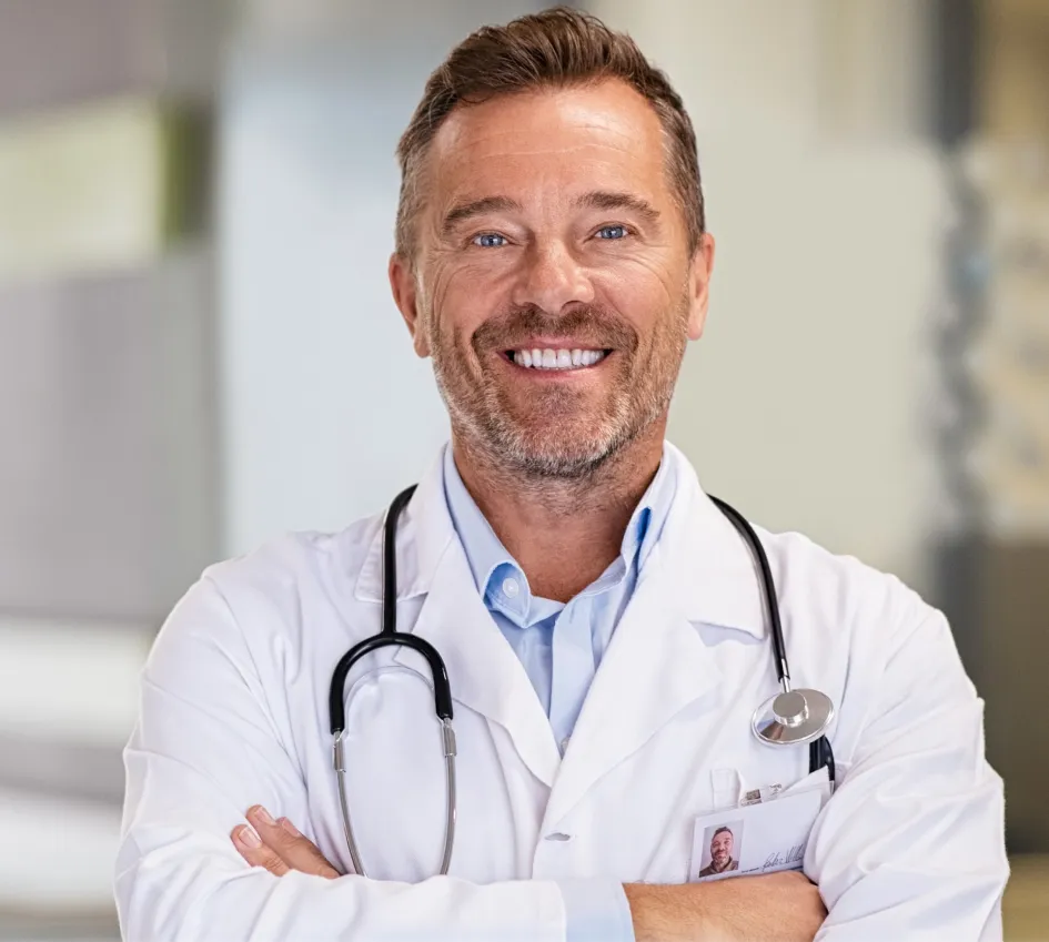 smiling-mature-doctor-in-hospital-hallway-2023-11-27-05-34-44-utc