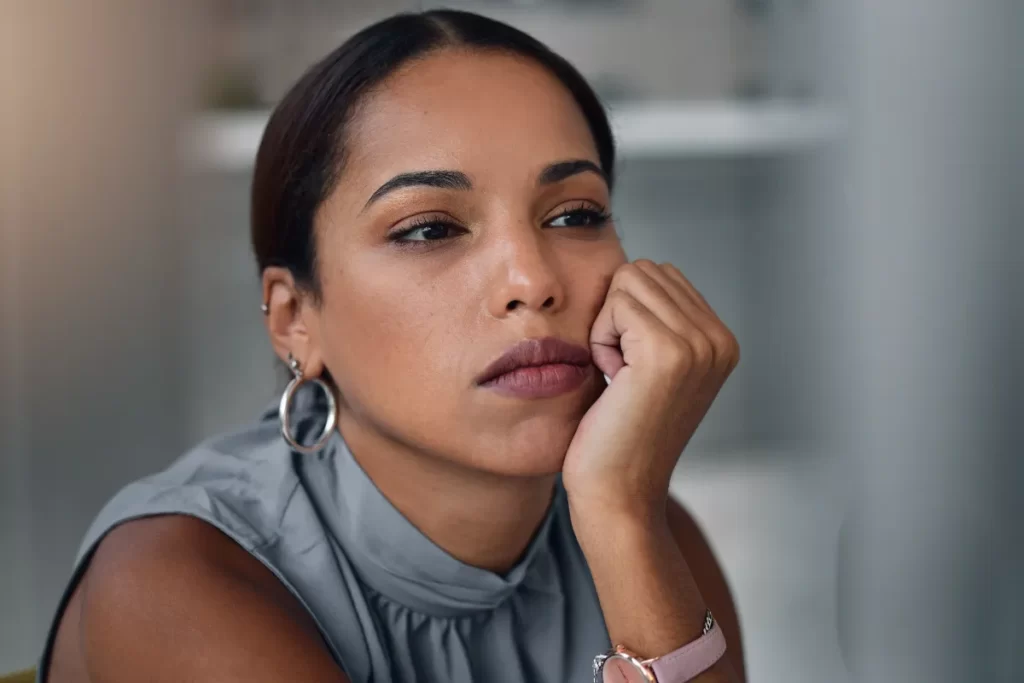 woman with pensive expression at the office utc ()
