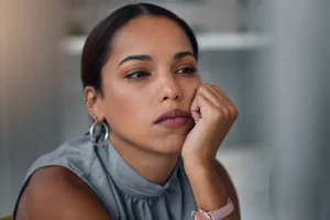 woman with pensive expression at the office utc ()