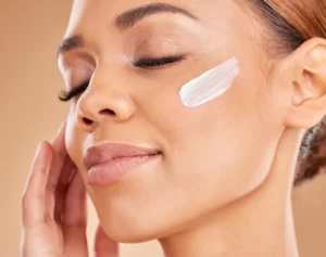 woman face and moisturizer cream for skincare bea utc