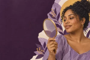 An adult woman with natural skin texture looks toward a mirror.