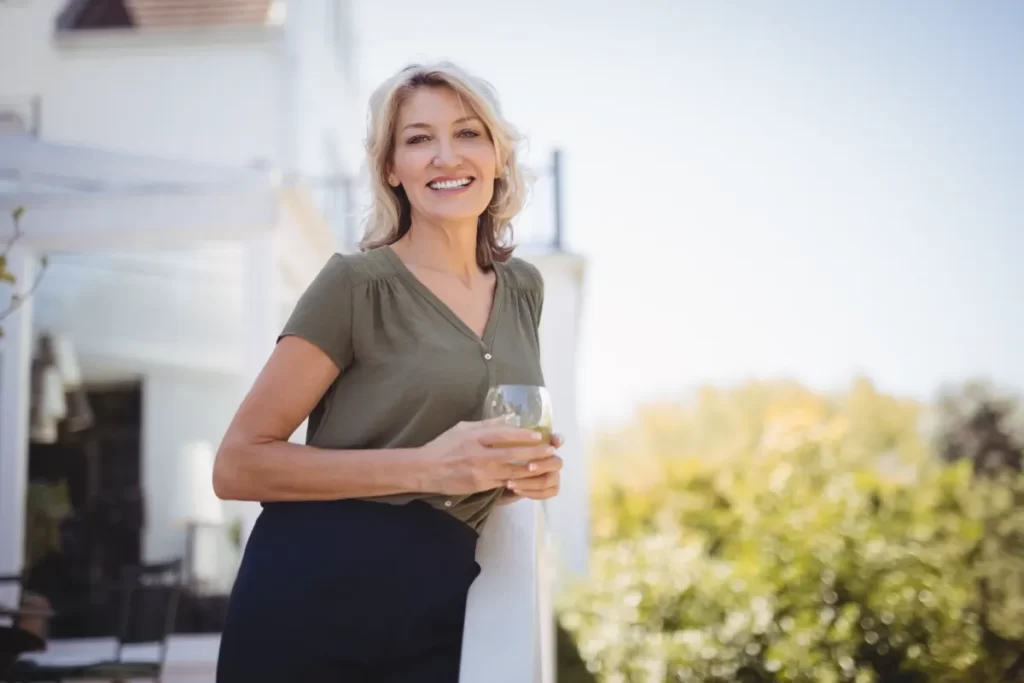 happy woman relaxing outdoors on a sunny day utc