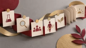 Cranberry and pale-gold ribbons connect folded cream archival-paper forms with abstract icons on a dove-gray surface.
