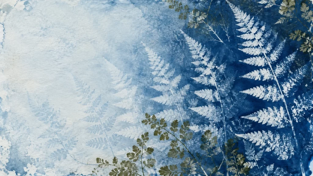 Prussian-blue and olive cyanotype-style fern shadows fading across white paper.