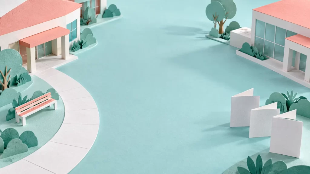 Seafoam and coral architectural paper illustration with pathways between buildings.