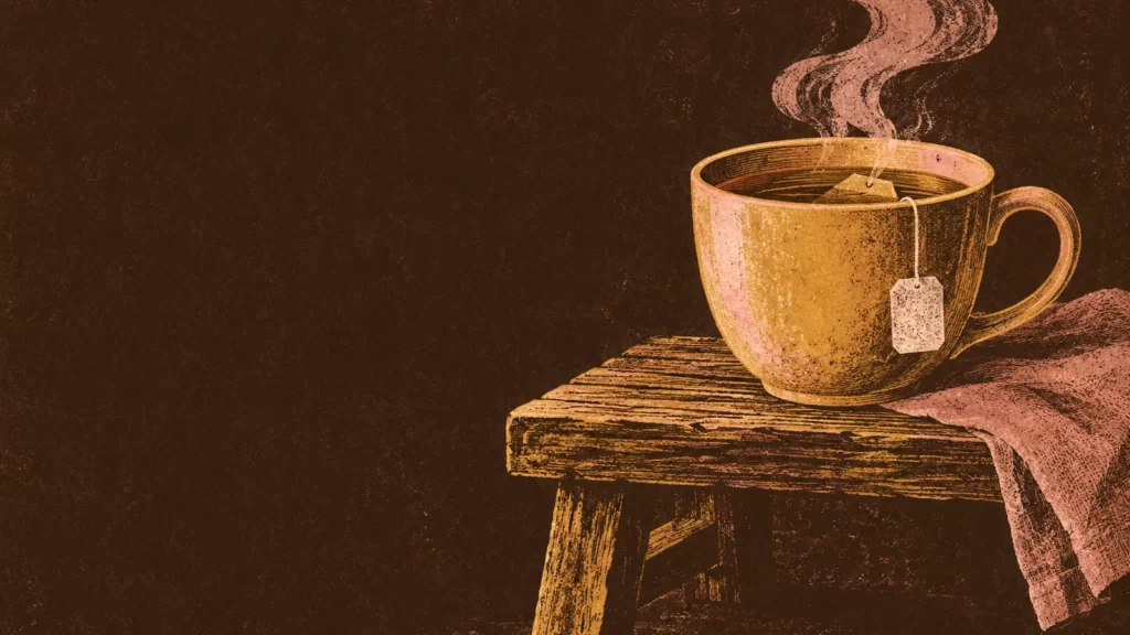 Honey and sable woodcut of a cup of tea steaming beside a wooden bench.