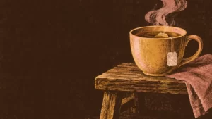Honey and sable woodcut of a cup of tea steaming beside a wooden bench.
