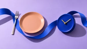 Lavender and peach plate, decorative clock and ribbon shapes.